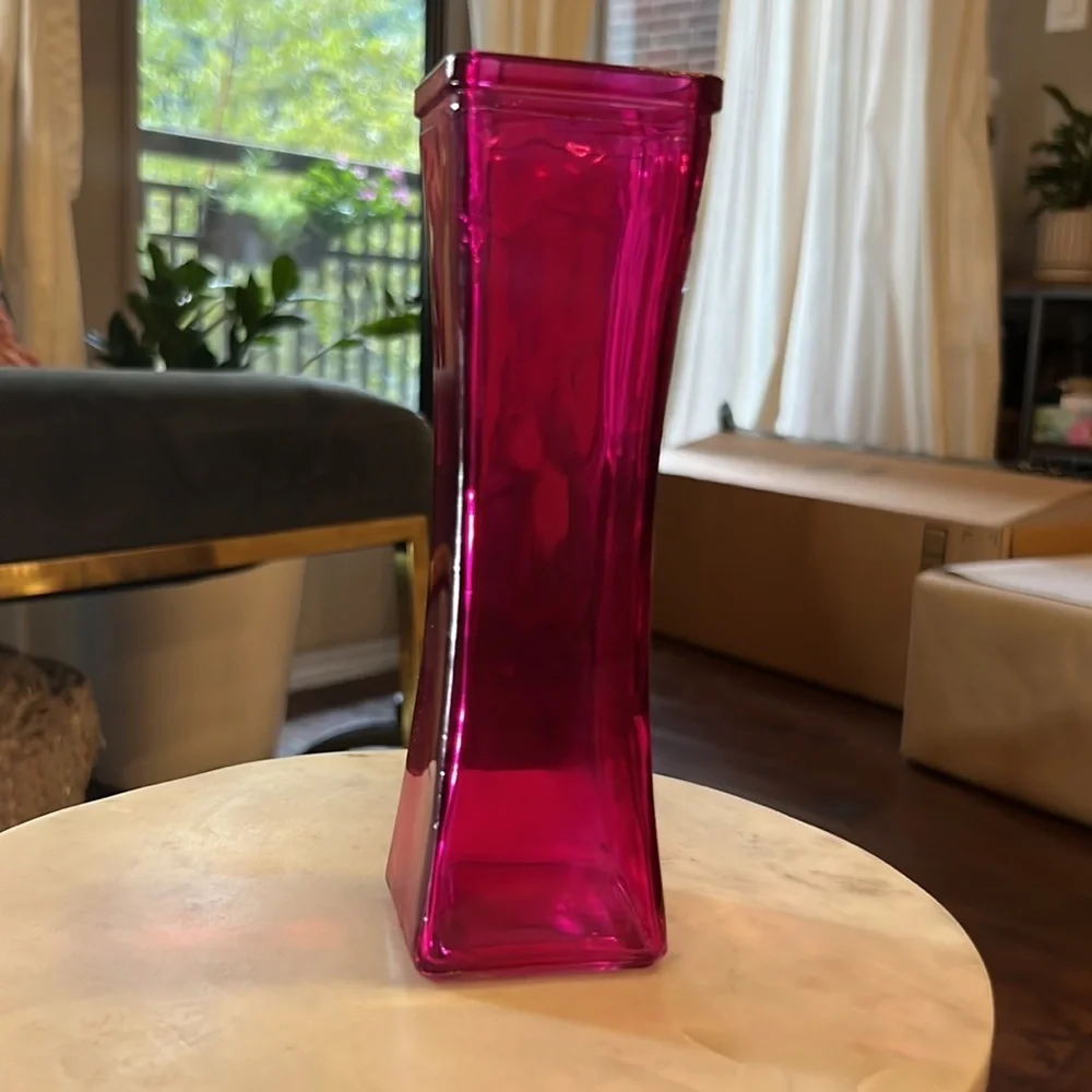 Pink glass narrow 7.5” tall 2.25” wide at widest part top & bottom, 1.75” middle